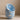 Stack of blue Cloud Cereal Bowls on a beige surface