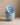 Stack of blue Cloud Cereal Bowls on a beige surface