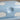 Close-up of the speckled blue lid with white clouds