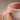 Close-up of the Cloud Sunset mug rim, handle and speckled pink glaze with a white cloud