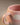 Close-up of the Cloud Sunset mug rim, handle and speckled pink glaze with a white cloud