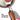 Hand holding the soft black handle of the OXO turner while lifting a burger patty