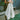 Woman holding the Koko bath towel outdoors