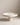 White Party Cake Stand on a beige surface