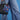 Nordic Ski bag folded into its pouch and clipped to a black handbag