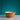Ochre Mason Cash bear mixing bowl on a white table against a teal wall
