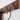 Close-up of the black hooks on the Yamazaki Ply walnut rack