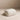 White Party Butter Dish with domed lid on a beige surface