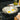 Goldilocks Tri-Ply clad 10-inch fry pan by GOLIDILOCKS, showcasing a shiny stainless steel cooking surface with a black handle.