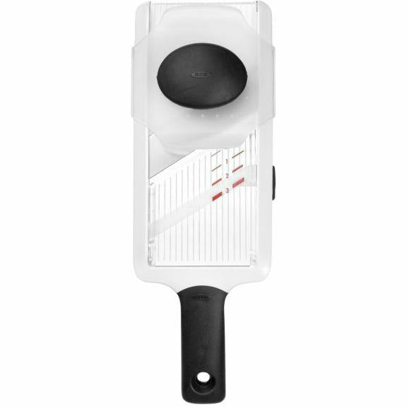 OXO hand-held mandoline slicer with adjustable blade for precise vegetable and fruit slicing.