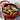 Staub round cocotte in Cherry, lid removed, showing matte black interior