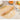 Small wooden rolling pin on rolled dough with flour and eggs