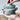 Le Creuset mini cocotte souffle dish with vibrant enamel finish and round shape, perfect for individual servings.