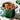 Le Creuset 8-quart stock pot with a colorful enameled exterior, sturdy handles, and a stainless steel lid for cooking soups and broths.