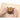 Pressing the apple corer down over an apple on a cutting board