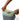 Hands tucking a compost bag into the rim of the charcoal bin