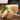 HIC bamboo steamer basket with multiple tiers for steaming vegetables, dumplings, and Asian cuisine in a traditional kitchen setting.