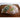 Soup sock holding a whole chicken and vegetables on a cutting board