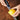 Microplane Zester and Grater with stainless steel surface for zesting citrus and grating cheese or spices.