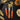 Messermeister pumpkin carving tools with pumpkin seeds and small pumpkins on a dark table