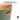UMBRA Woodrow Can trash can with a sleek wooden finish and stainless steel foot pedal for easy waste disposal.