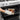 Oxo silicone oven mitt with textured grip, heat-resistant kitchen glove for handling hot cookware and baking trays.