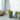 UMBRA Woodrow Can trash can with a sleek wooden lid and black body, designed for modern kitchen or office use.
