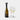 Rabbit bottle stopper in a wine bottle beside two glasses wearing wine charms