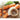 Full Circle Ring Vegetable Brush in use, showing its circular design for cleaning vegetables effectively.