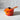 Le Creuset 1.75-quart iron handle sauce pan with flame-colored exterior and sturdy handle, ideal for cooking sauces and small meals.