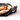 Pizza crust lifted from the Emile Henry stone, showing the logo on the handle