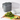 OXO charcoal 1.75 gallon compost bin closed on a counter beside a cutting board of greens