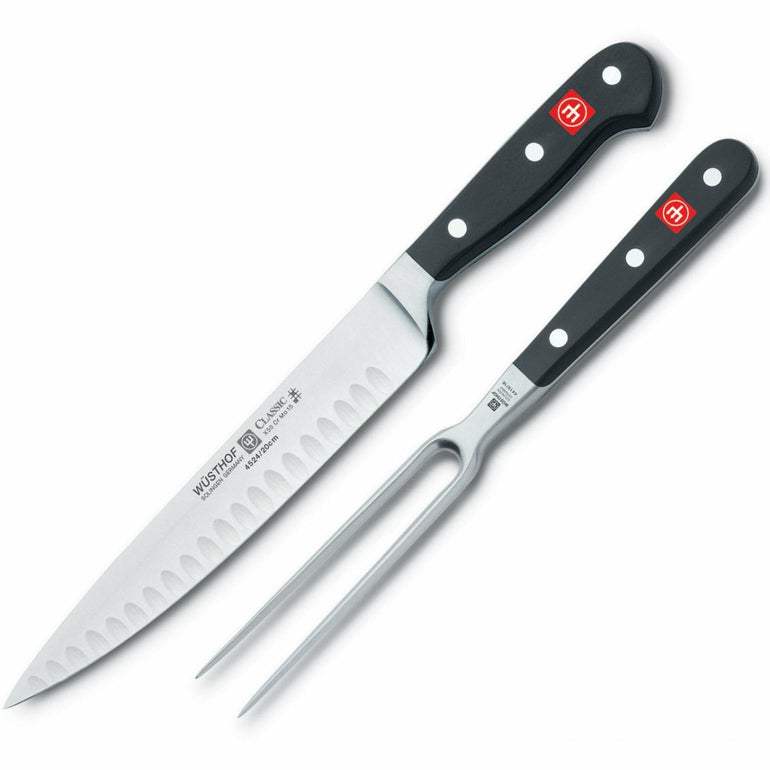 Wusthof 2-piece carving set with a carving knife and fork, stainless steel handles, ideal for slicing meats and poultry.