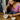 Woman torching crème brûlée at a kitchen table
