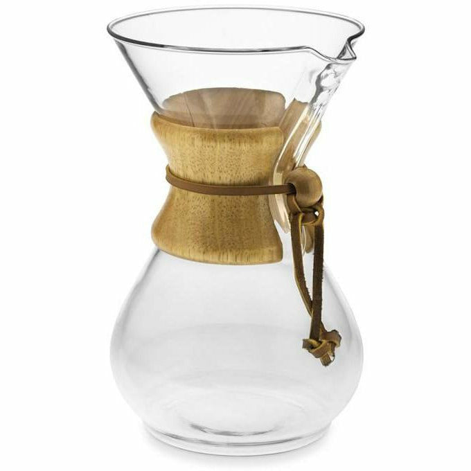 Chemex glass pour-over coffee maker with wooden collar and handle, showcasing its elegant design and brewing process.