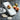 OXO Simple Mandoline with adjustable blade for precise slicing of vegetables and fruits in a kitchen setting.