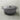 Le Creuset 9-quart round Dutch oven with a vibrant enamel-coated cast iron exterior and sturdy lid for versatile cooking.