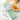 Benriner mandolin slicer with its four interchangeable blades laid alongside