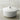 Le Creuset 5.5Qt. round Dutch oven with matte enameled cast iron, showcasing its sturdy, colorful cookware design.