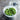 OXO Salad Spinner with clear plastic bowl and spinning lid for drying fresh greens and vegetables.