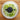 OXO Salad Spinner with white plastic bowl and crank handle for drying washed salad greens and vegetables.