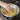 Natural wood pan scraper from Epicurean with a comfortable handle, designed for gentle cleaning of non-stick cookware.