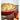 Emile Henry ceramic pie dish with fluted edges, showcasing a freshly baked fruit pie inside on a rustic wooden surface.