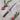Shun Classic utility knife on a stone surface with radishes and rosemary
