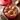 Le Creuset 5.5Qt. round Dutch oven with a colorful enameled cast iron exterior and sturdy lid, ideal for cooking and serving.