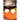 Hedgehog Dryer Buddies on an orange towel at the opening of a dryer drum